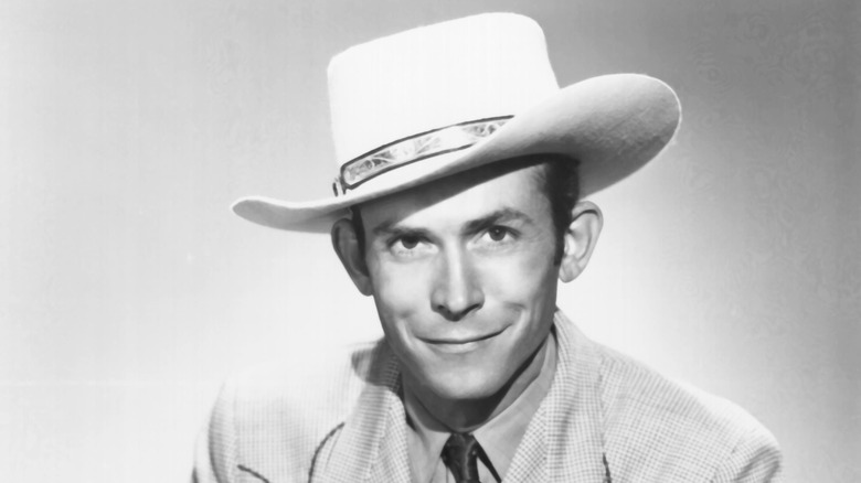 Hank Williams smiling and wearing hat
