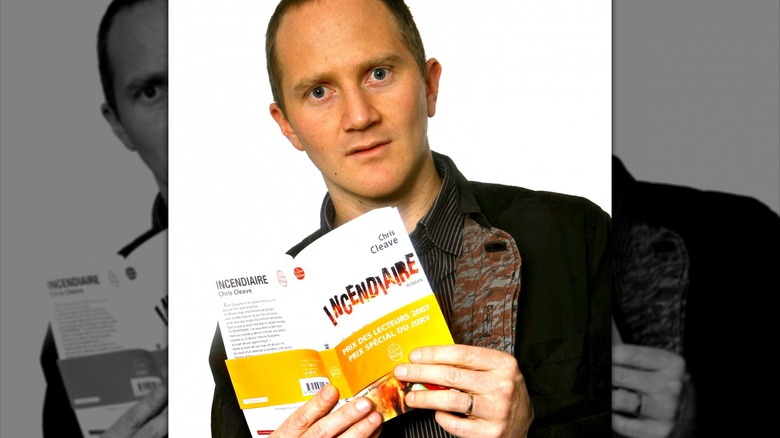 Chris Cleave holding his book Incendiary