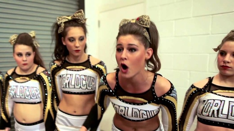 Competition cheerleaders react backstage