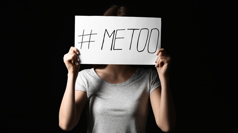 woman holding a #metoo movement sign