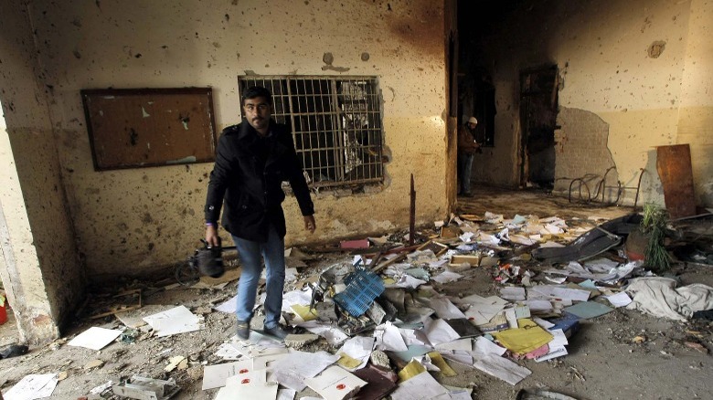 Man in wrecked classroom