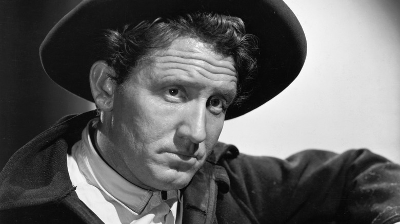 Spencer Tracy posing in hat