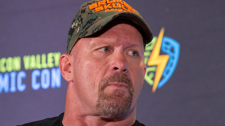 Steve Austin wearing a cap and looking to the side