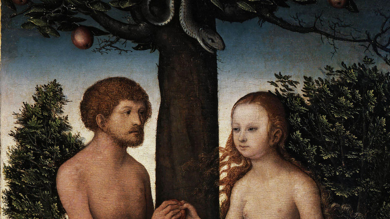 close-up of a painting showing Eve giving Adam an apple