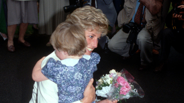 Princess Diana hugging a child