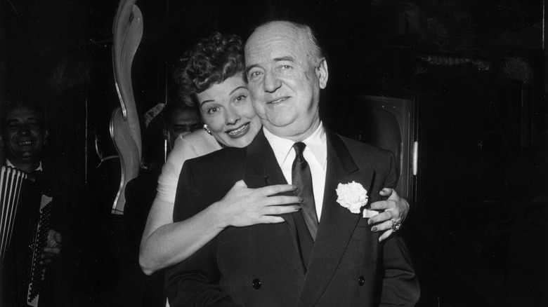 Lucille Ball hugging William Frawley suit at event