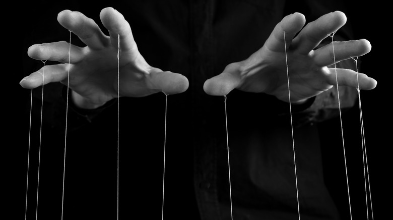 Hands with puppet strings