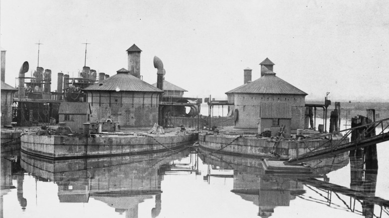 U.S.S. Montauk, left, docked in 1902
