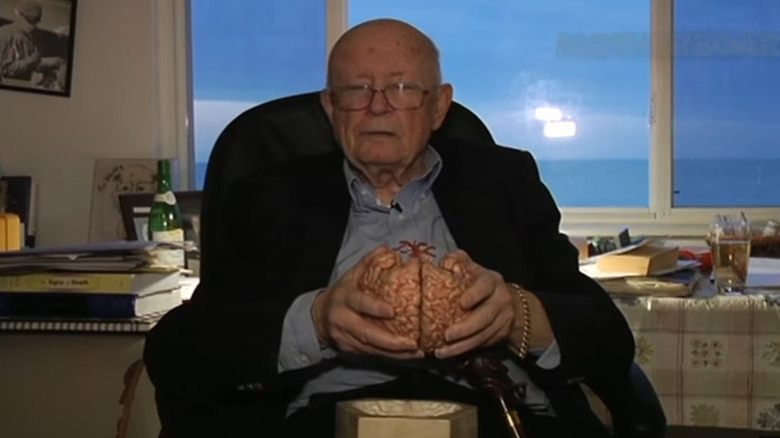 Dr. Robert White holding brain