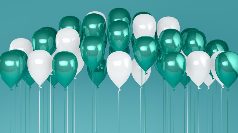green and white helium balloons