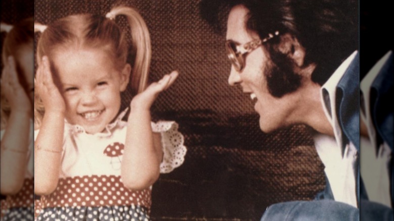 Elvis with Lisa Marie smiling