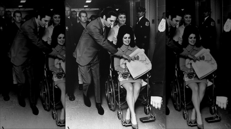 Elvis and Priscilla Presley leaving hospital with Lisa Marie