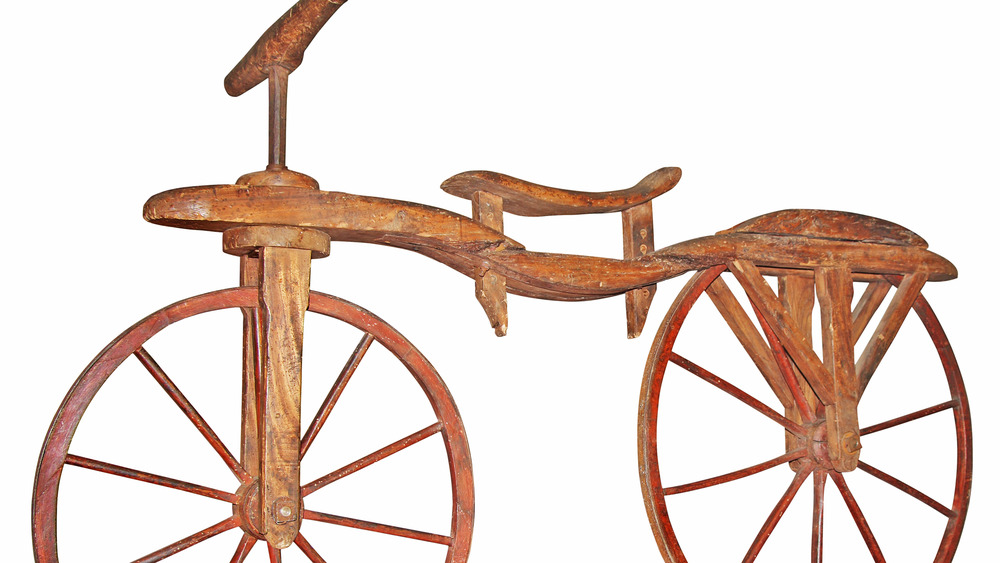 Reconstructed wooden 19th century bicycle without pedals