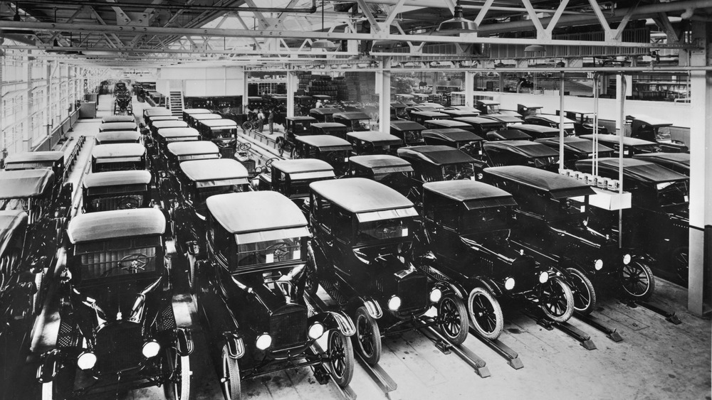 Inside a Ford production plant with cars lined up