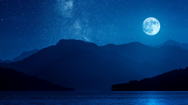 Magical full moon over lake