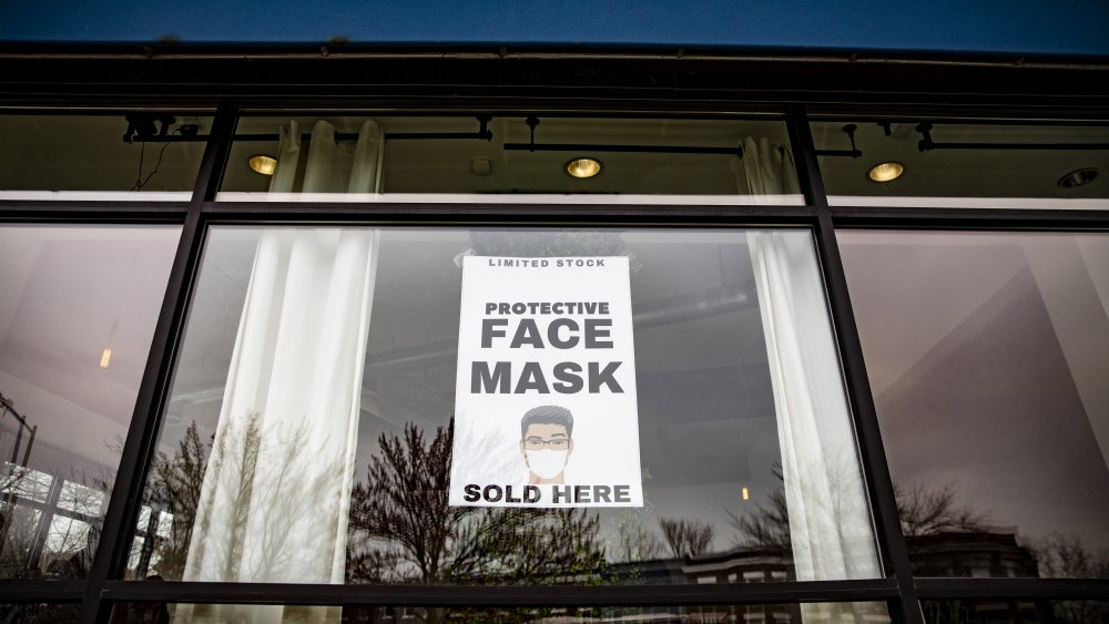 sign for wearing face mask store window