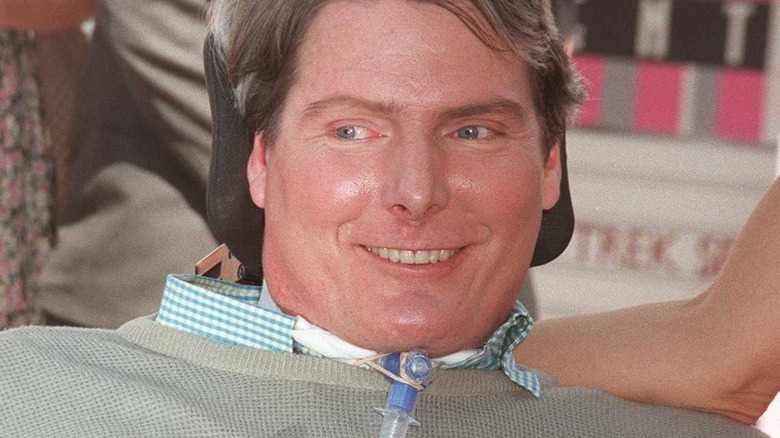 Christopher Reeve in a wheelchair, smiling after the accident
