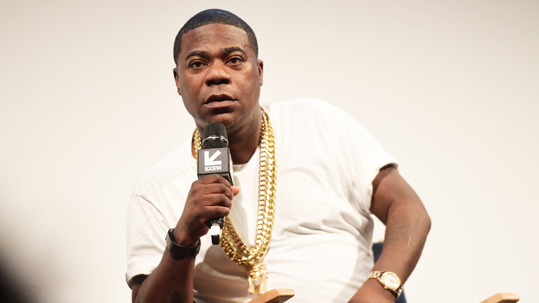 Tracy Morgan speaks with a microphone