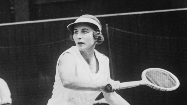 Helen Wills prepares for a tennis shot