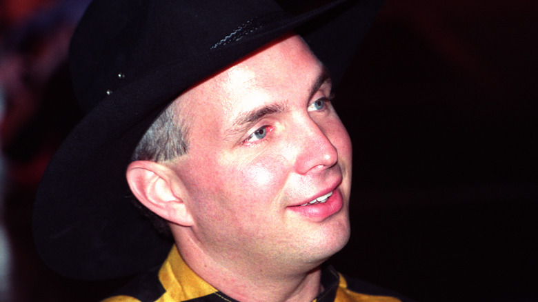 Garth Brooks smiles looking to right