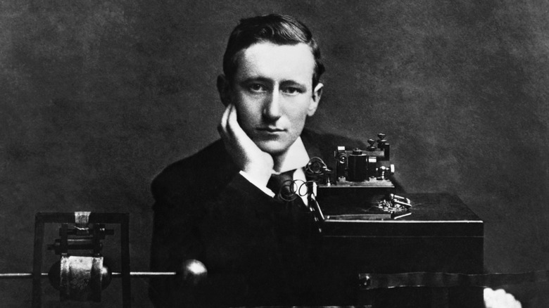 Guglielmo Marconi posing with radio