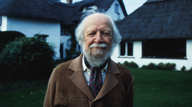 William Golding standing in front of his house