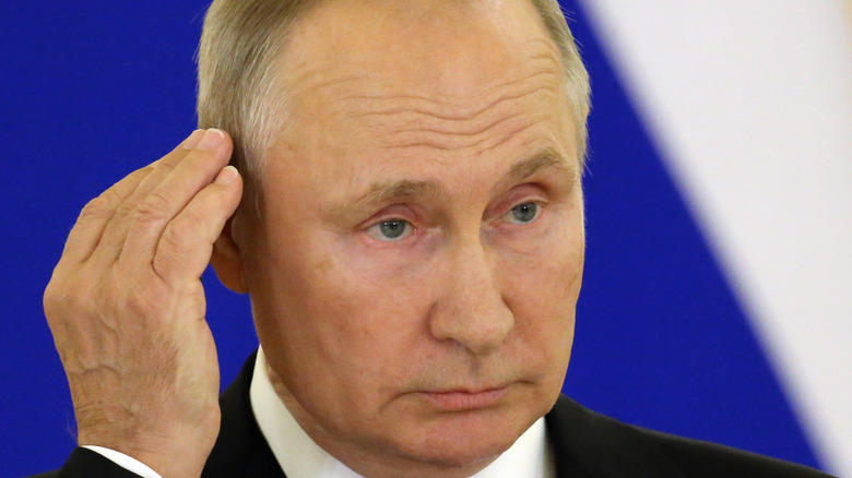 Valdimir Putin cupping ear