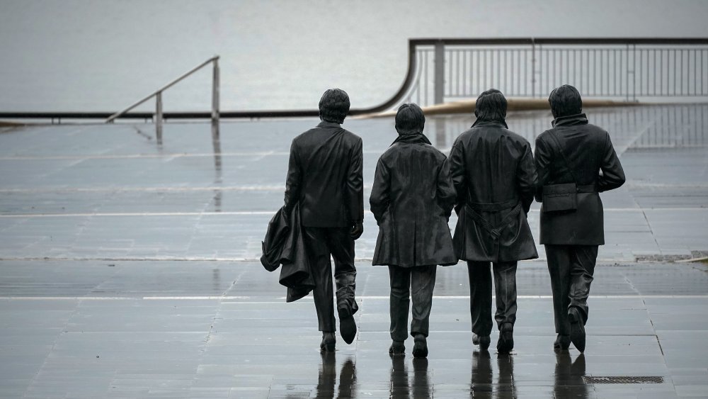 A statue of the Beatles looking over Merseyside 