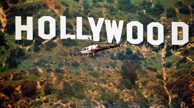 Helicopter flying over Hollywood sign