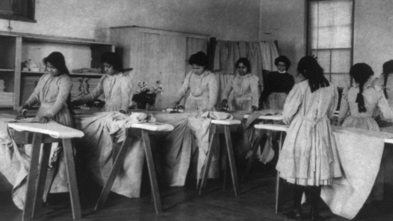 Native american women ironing