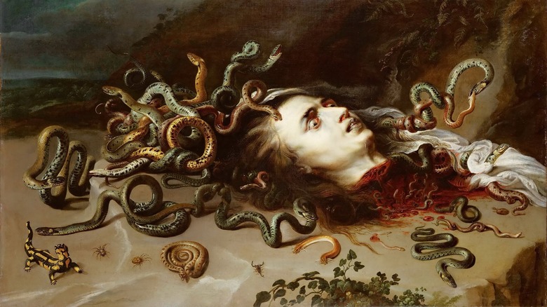 Medusa's severed head on ground