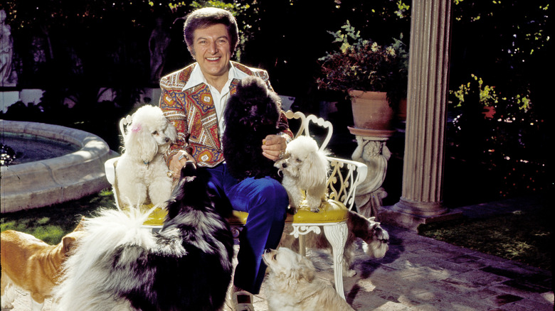 Liberace with his dogs