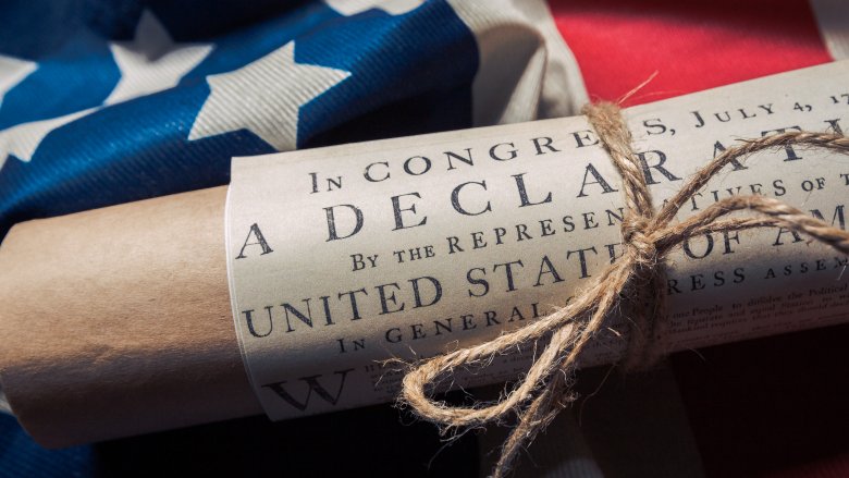 Declaration of independence wrapped rolled american flag