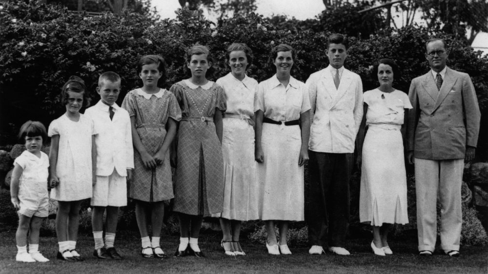 The Kennedy family posing for photo outside