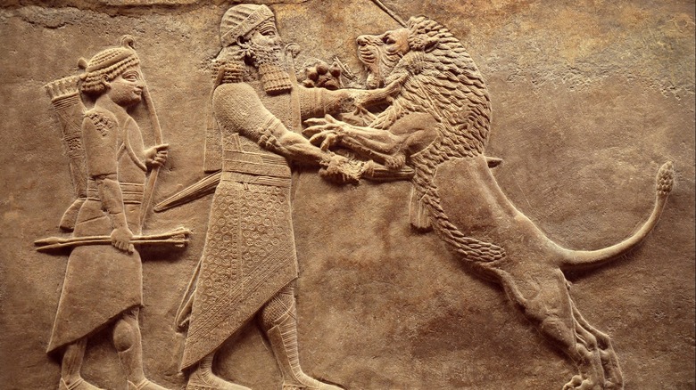 Ashurbanipal fighting lion engraving