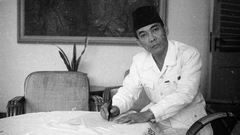 President Sukarno writing