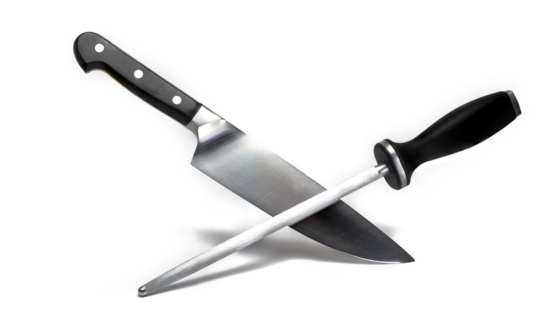 large sharp meat kitchen knife crossed 