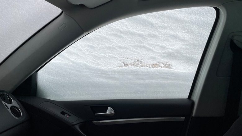 Car trapped in snow interior
