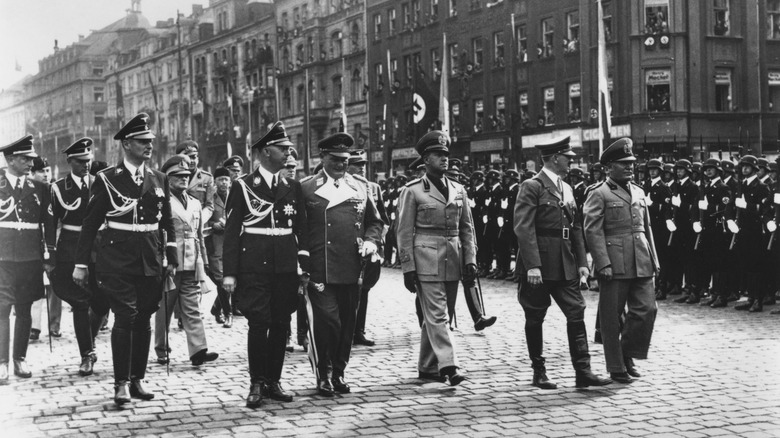 Benito Mussolini and Adolf Hitler walking