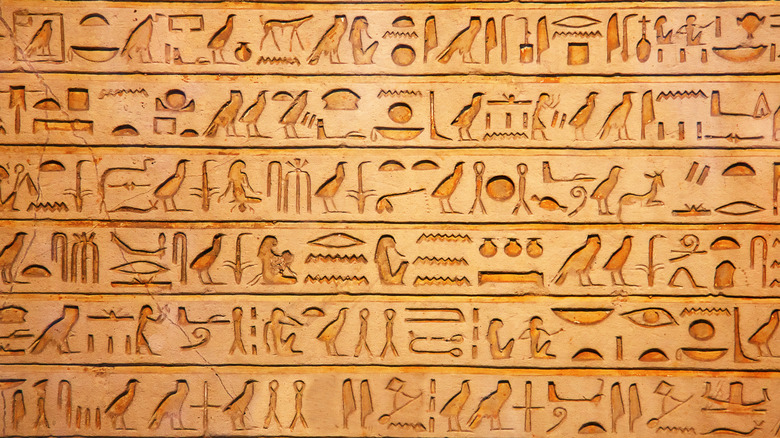 Egyptian hieroglyphics cover a wall