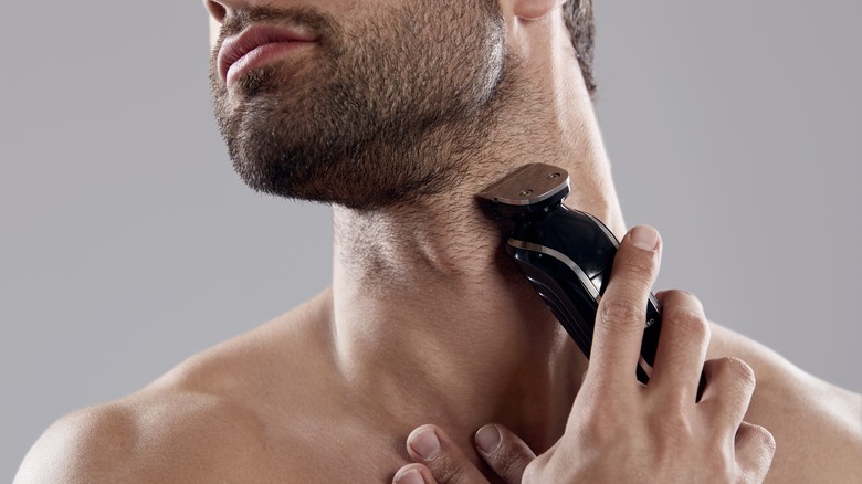 guy using electric shaver