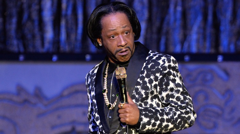 katt Williams on stage with microphone