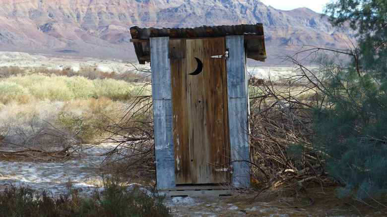 Old outhouse in desert