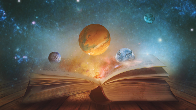 Planets swirling out a book