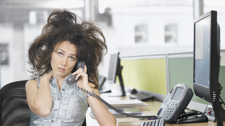 frustrated office worker poofed hair