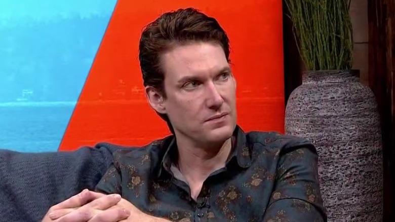 Billy Jensen seated during an interview