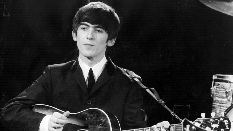 George Harrison playing guitar
