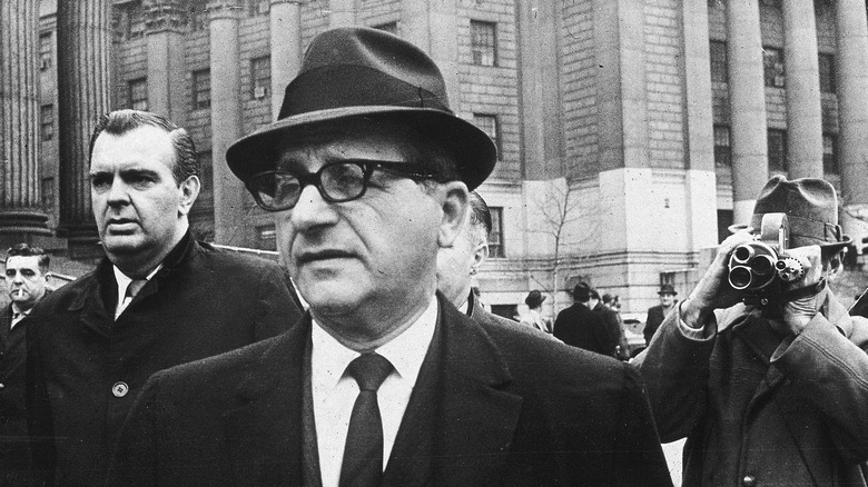 Sam Giancana hat surrounded by press