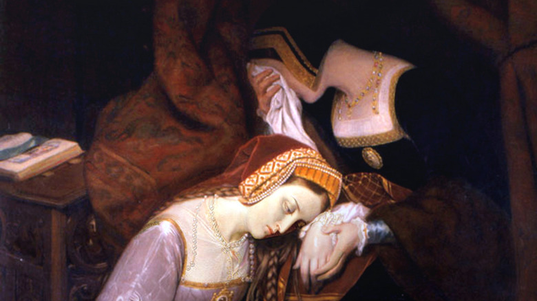 Anne Boleyn kneeling next to weeping woman