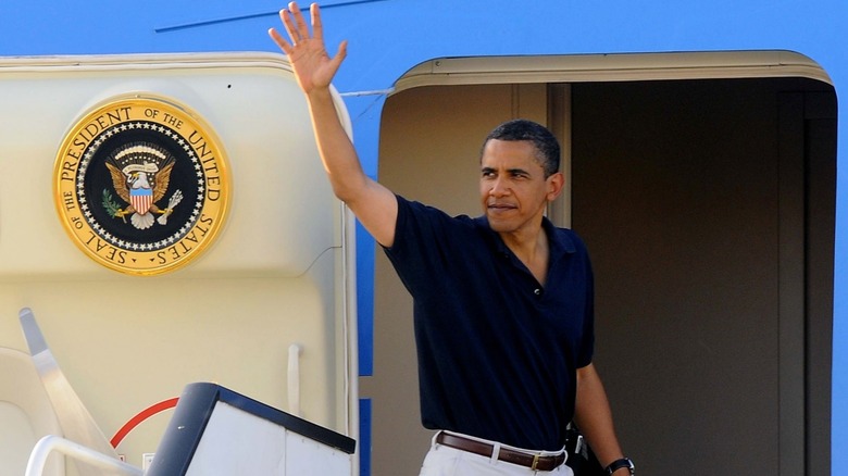 Obama boarding Air Force One waving